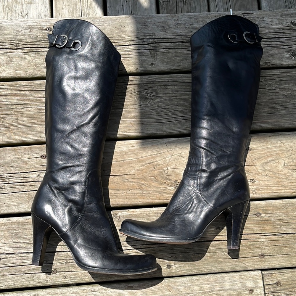 Gorgeous black leather boots with zipper and buckle detail